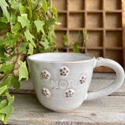 Mor kop med sm� blomster