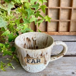 FAR kop i fine creme og brune nuancer