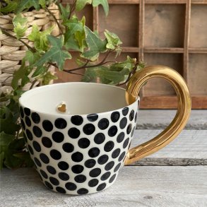 Kop med guld hank og hjerte