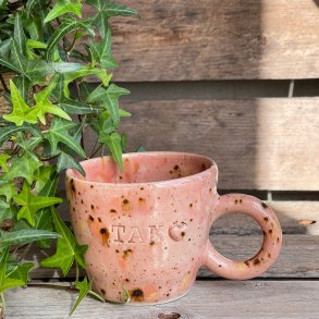 Kop med teksten �Tak� 