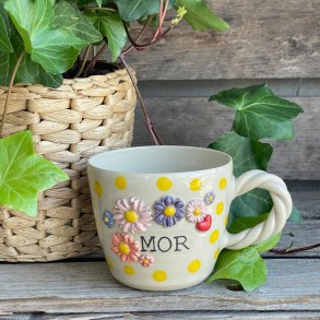 Mor blomsterkop med solskins dots